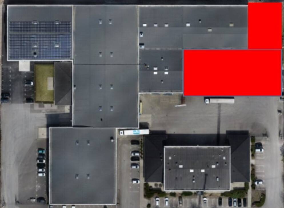 Ovanifr&aring;nbild p&aring; Alutrades lokaler med den planerade utbyggnationen markerad i r&ouml;tt.